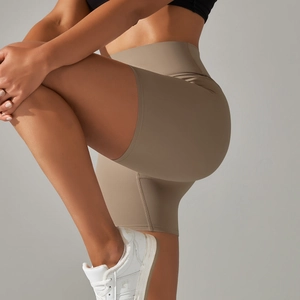 Detail of high-waisted earthy khaki yoga shorts with double-sided brushed texture