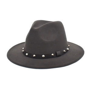 Detail of dark grey wool fedora hat featuring silver rivets and studs on black band