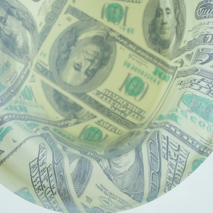 Close-up of luxury dollar bill print on the fabric detail of this novelty party hat