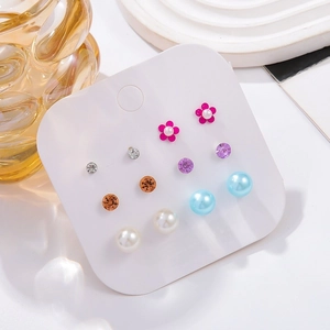 Assorted earring set with faux pearls, rhinestones and colorful resin studs on display