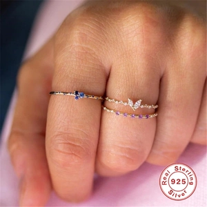 Detail view of 925 sterling silver rings with colorful sapphire and zircon stackable bands