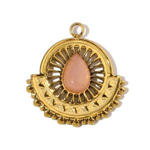 Macro shot of French gold drop pendant with pink natural stone and geometric details