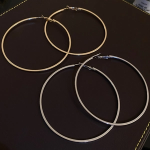 Exaggerated large metallic geometric hoop earrings in gold and silver finish
