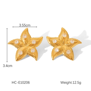 Detailed view of 18K gold star flower earrings with white zircon and size dimensions
