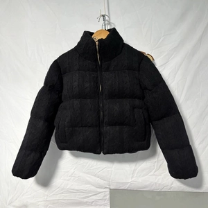 Women's black chunky cable knit puffer jacket with stand collar and front zipper