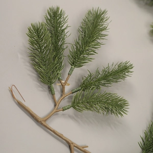 Artificial green PE pine branches for Christmas wreaths and home holiday decorations