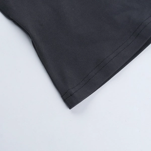 Close-up of premium black knitted cotton fabric with high-quality double-needle stitching