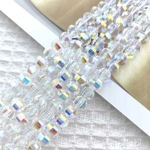 Macro shot of 8mm faceted glass beads with rainbow iridescent luster for DIY jewelry