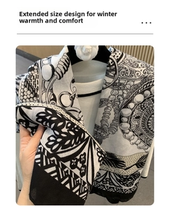Detail of extra-long black and white floral print scarf with elegant pearl patterns