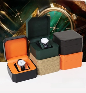 Detail of octagonal PU leather watch boxes in various colors with matching soft cushions