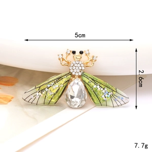 Detailed view of bee jewelry with green translucent wings and crystal rhinestone body
