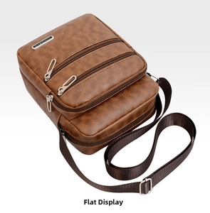Close-up of brown PU leather men's messenger bag showing multi-layer zipper pockets