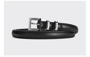 Close-up of black leather slim belt featuring a silver square buckle and dual metal loops