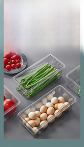 Close-up of transparent PET drawer storage box for organizing eggs and vegetables in fridge