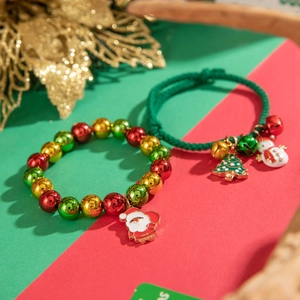 Detailed macro view of colorful Christmas bracelets with Santa and reindeer charms