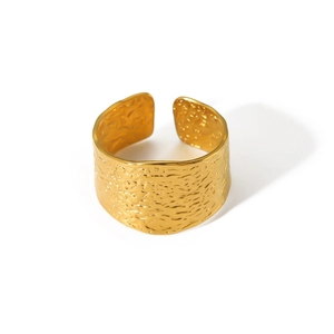 Wide C-shaped 18k gold plated stainless steel ring with hammered texture on white background