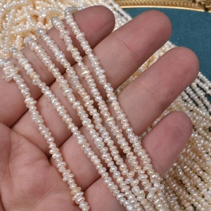 Strand of 2.5mm natural freshwater seed pearls in creamy white for DIY jewelry making