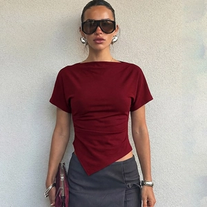 Detailed view of the asymmetrical hemline and dark red knit fabric on this slim-fit T-shirt
