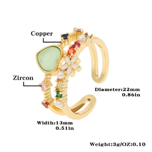 Detail view of heart ring with green gemstone, pearls and zircon showing 22mm diameter