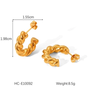 Chic gold-toned C-shaped twisted titanium steel earrings with a spiral texture design