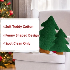 Detail of plush forest green Christmas tree pillow showing soft teddy fleece texture