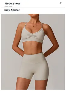 Detail of greyish apricot V-neck yoga bra with ruched front and high waist shorts