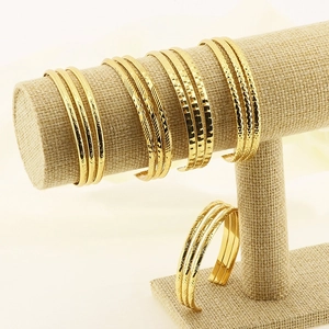 Vintage gold triple-layered open cuff bracelets set with various engraved textures