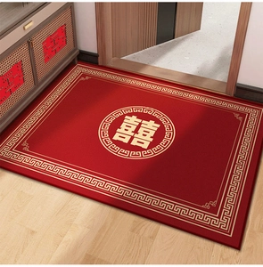 Detailed top view of red Belgian velvet wedding rug with golden Double Happiness symbol