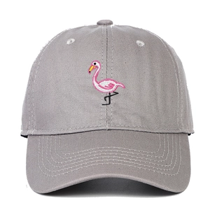 Detailed embroidery of a pink flamingo on a grey washed cotton baseball cap texture