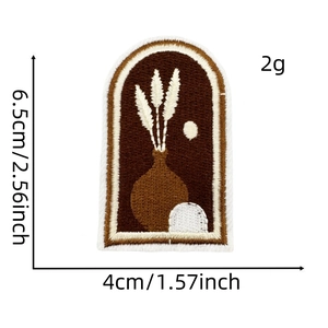 Detail of embroidered patch showing height of 6.5cm and width of 4cm with a vase design
