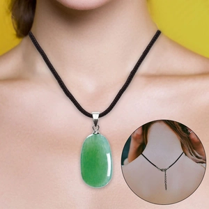 Detail showing the adjustable black cord clasp and extension chain on the green jade necklace