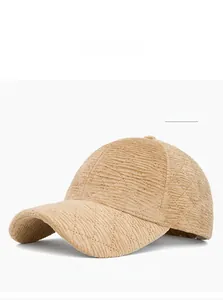 Detailed view of striped khaki corduroy baseball cap with diamond quilted texture
