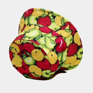 Detail of vibrant apple print on bucket hat showing high-quality stitching and cotton fabric