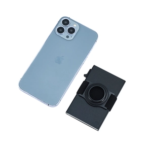 Minimalist black aluminum RFID blocking wallet with AirTag holder next to a smartphone