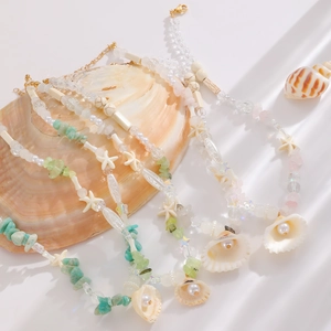 Handmade seashell and gemstone beaded necklaces with pearl pendants for beach vacations