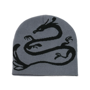 Dark grey knitted beanie with black dragon jacquard pattern for winter warmth
