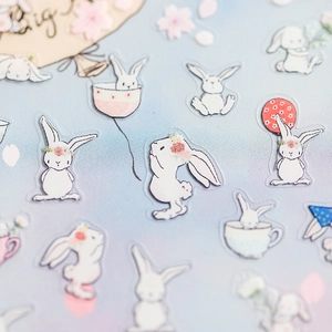 5D embossed rabbit nail stickers with white bunny patterns on light blue background