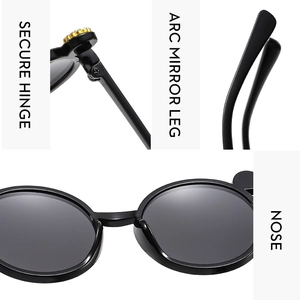 Kids black cat-ear sunglasses detail shot showing secure hinge, smooth mirror leg, and comfortable nose.