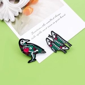 Gothic animal skull enamel pins with bird and fish skeletons and red rose details