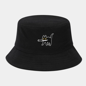 Close-up of black cotton bucket hat featuring a cartoon cat embroidery with a knife