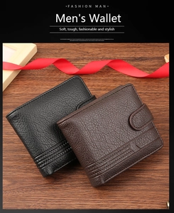 Close-up of pebble grain leather texture on men's bifold wallets with snap button