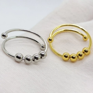 Double layer stainless steel anxiety ring with movable beads in silver and gold colors