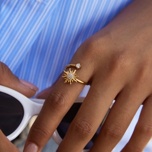 Gold-plated stainless steel sunburst open ring with sparkling white cubic zirconia