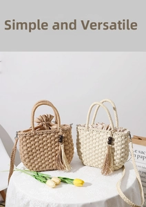 Detail of woven straw handbags with wood bead tassels in brown and beige colors