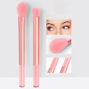 Macro detail of high-quality pink eyeshadow brushes with soft eco-friendly bristles