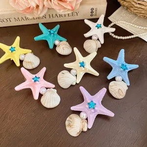Starfish and shell hair clips with pearls and sequins in seven vibrant coastal colors