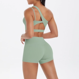 Sage green sports set with one-shoulder asymmetrical back design and high waist shorts