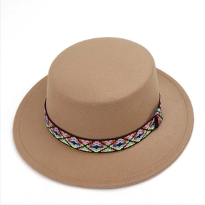 Detail of camel wool felt boater hat with colorful geometric ethnic patterned ribbon band