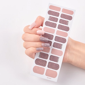 Detail of pink and black polka dot self-adhesive nail stickers model SS-033 shown on model