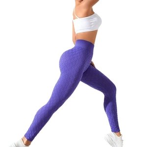 Purple high-waisted yoga leggings with geometric knit texture and butt lifting design